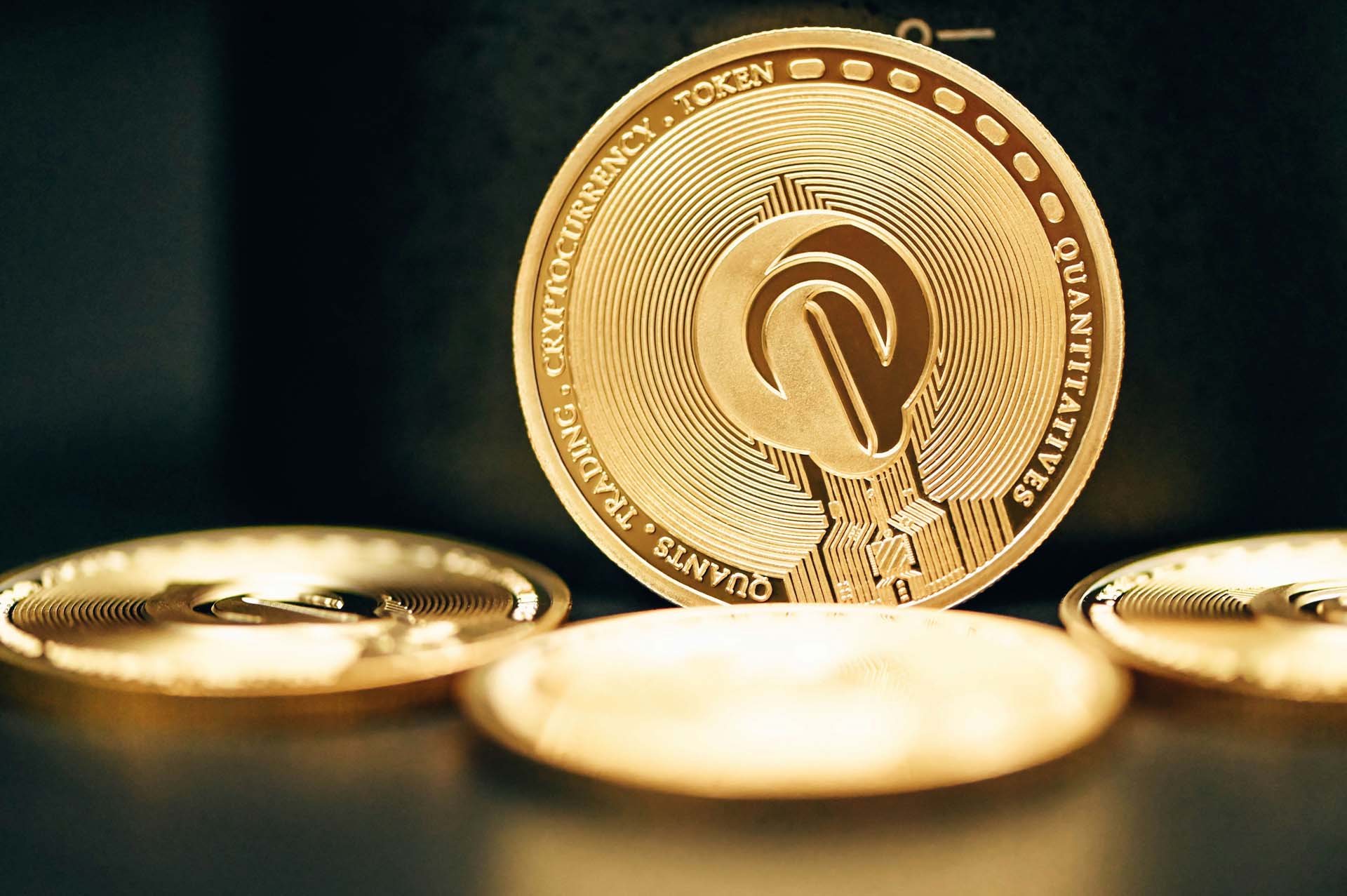 Gold coin with a quantitative trading symbol, indicating one form of cryptocurrency investment.